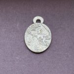 Intricate silver pendant with design geisha with swords